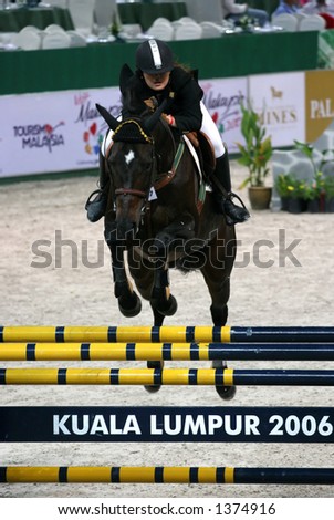 Horse jumping in indoor stadium in Kuala Lumpur
