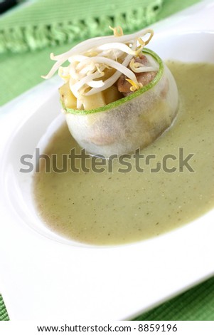 Cucumber wrapped chicken and potato chunks, topped with mung bean sprouts in cucumber sauce