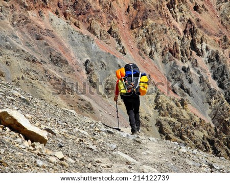 climber going away on mountain path