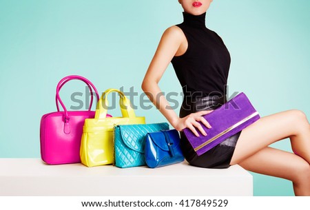 Woman sitting with colorful bags. leather products fashion image.