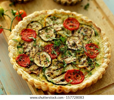 Quiche with grilled zucchini, tomato and herbs