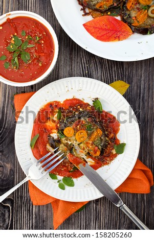 Grilled eggplants with mozzarella, parmesan, tomato, zucchini, capers,  herbs and tomato sauce