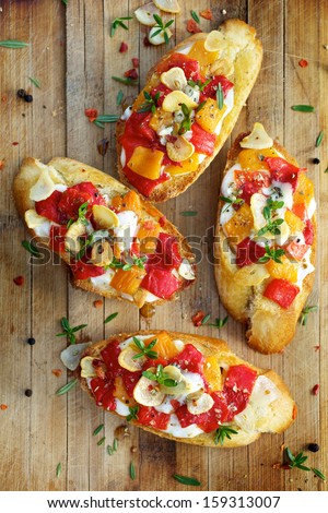 Bruschetta with roasted bell pepper, goat cheese, garlic and herbs