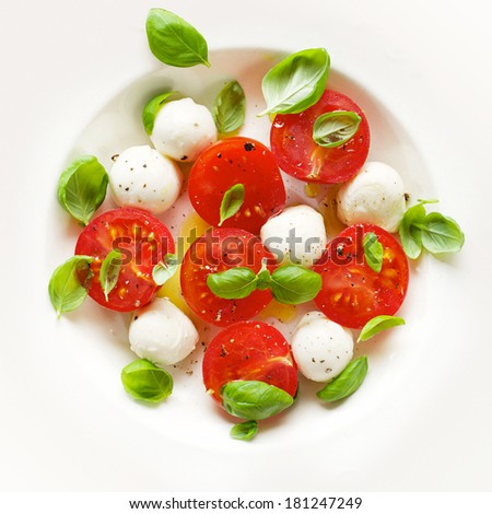 Fresh Caprese salad; mozzarella, tomatoes, olive oil and basil
