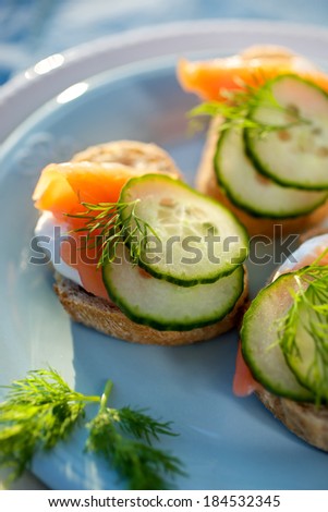 Canapes with smoked salmon, fresh cucumber and dill