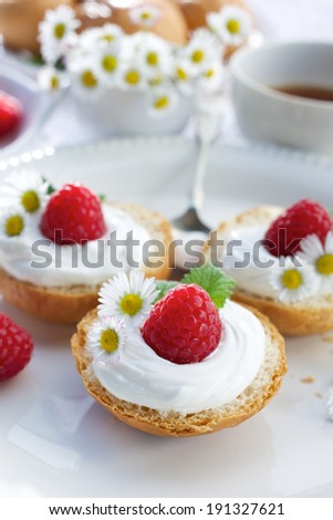 Buttery buns with creamy cheese and fresh raspberries