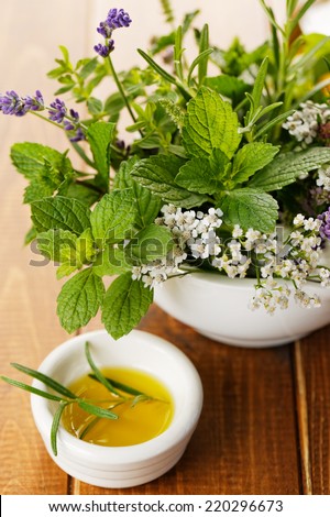 Fresh rosemary in olive oil and herb bouquet