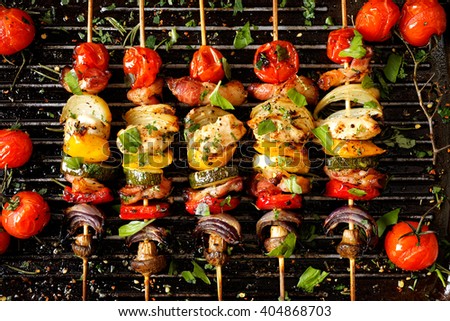 Vegetable and meat skewers in a herb marinade on a grill pan
