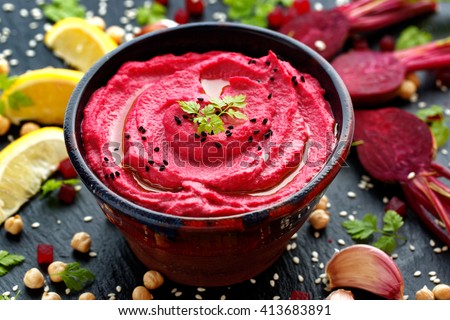 Beet hummus, creamy and delicious in a ceramic bowl