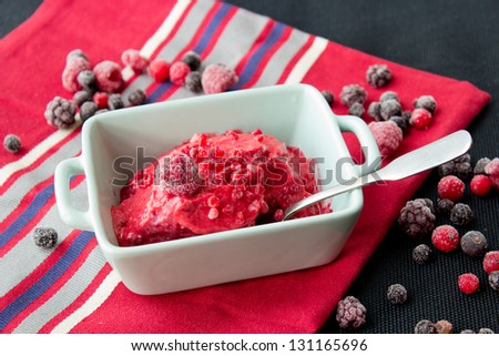 Home made raspberry ice-cream with red berry mix