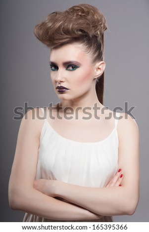 Fashion Model Portrait. Hairstyle. Haircut. Professional Makeup. Creative makeup. Closeup portrait. Studio shot.