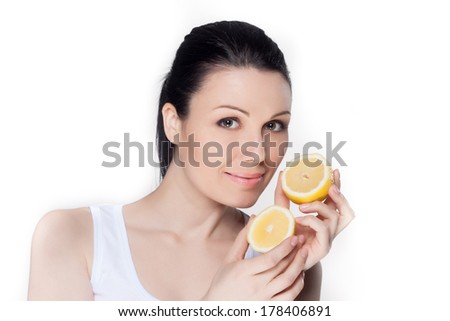 Beautiful young woman with lemons. Healthy food concept. Skin care and beauty. Vitamins and minerals.