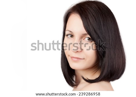 Close-up portrait of young beautiful woman with short hairstyle. Beautiful haircut. Short straight healthy hair. Skin care concept.