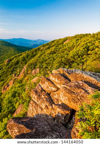 Evening light on a rock outcrop and the Blue Ridge Mountains from the Pinnacle, along the Appalachian Trail in Shenandoah National Park, Virginia.