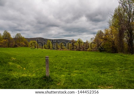 Trail marker in a meadow along the Appalachian Trail in Shenandoah National Park, Virginia.