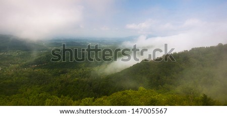 View of the Shenandoah Valley through fog and thick low clouds from Skyline Drive in Shenandoah National Park, Virginia.