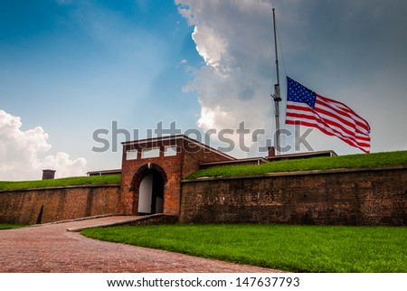 Summer storm clouds and American flag over Fort McHenry in Baltimore, Maryland.