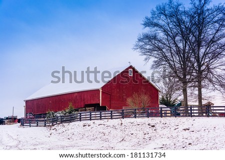 Red barn and snow-covered field in rural Adams County, Pennsylvania.