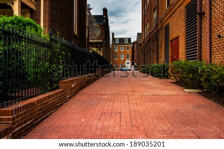 Brick alley and houses in Fells Point, Baltimore, Maryland.