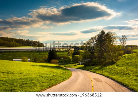 Country road and view of farm fields and rolling hills in rural York County, Pennsylvania.