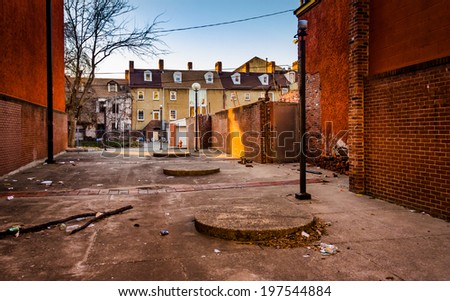 Dirty courtyard and houses in Baltimore, Maryland.