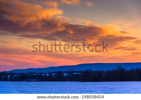 Winter sunset over a farm field in rural Frederick County, Maryland.