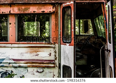A rusty, abandoned bus