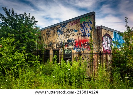 Old building covered in graffiti, seen from the Reading Viaduct in Philadelphia, Pennsylvania.