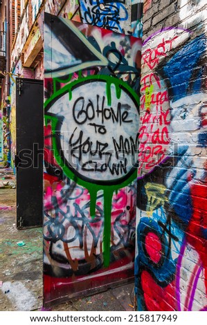 Graffiti on doors in Graffiti Alley, Baltimore, Maryland.