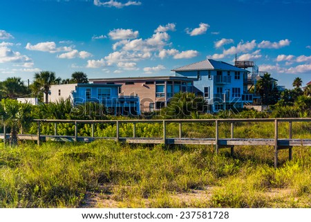 Bridge over dune grasses and beach houses in Vilano Beach, Florida.