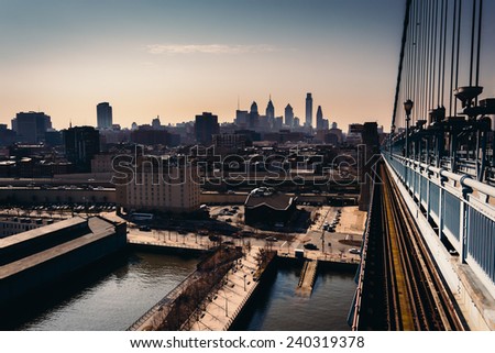 The Delaware River and skyline seen from the Ben Franklin Bridge Walkway, in Philadelphia, Pennsylvania.