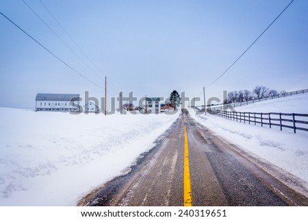 Snow covered farm along a country road in rural York County, Pennsylvania.
