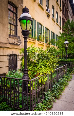 Gardens and townhouses along 23rd Street in Chelsea, Manhattan, New York.