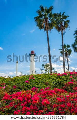 Flowers, palm trees, and Long Beach Harbor Lighthouse, in Long Beach, California.