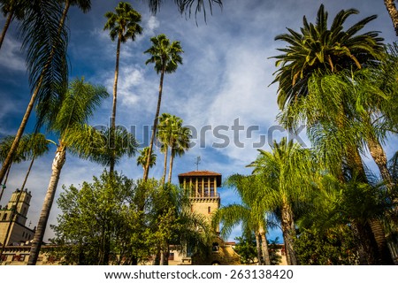 Palm trees and the exterior of the Mission Inn, in Riverside, California.