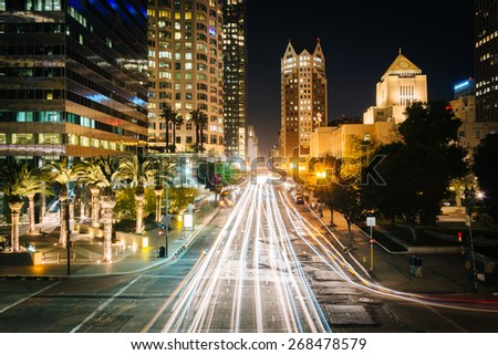Long exposure of traffic and buildings along 5th Street at night, in downtown Los Angeles, California.