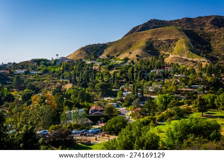 View of houses and hills in Hollywood from Canyon Lake Drive in Los Angeles, California.