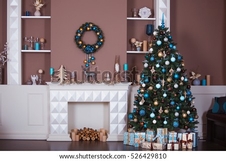 Christmas background. Interior room decorated in xmas style. No people. New year tree and fireplace