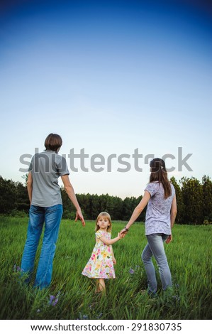 Mother, father and daughter
