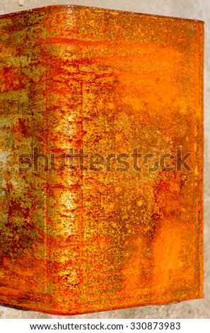 Rusty oil can washed up on beach Asia rusty oxidizing metal patterns and textures.