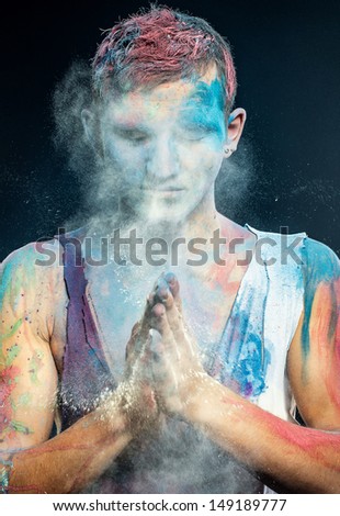 the guy costs having put hands together, in paint and a dust and meditates