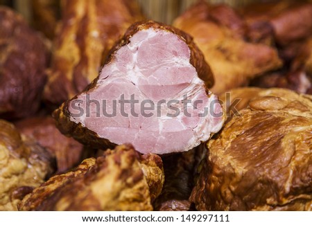 sale of meat cooked smoked ham, a piece cut off
