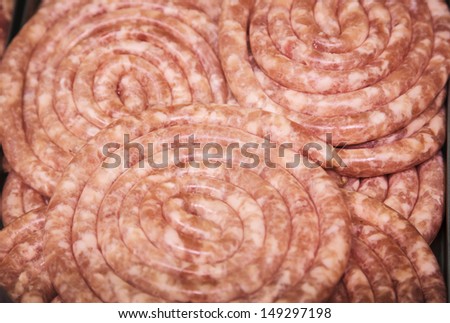 in the meat tray raw pork beef, sausage twisted
