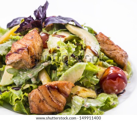 salad with smoked red fish with fresh lettuce leaves on a white background