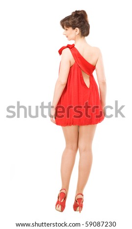 woman demonstrates red evening gown on white background