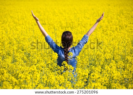 Woman cheering in the rape field