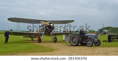 OLD WARDEN, BEDFORDSHIRE, ENGLAND - MAY 24, 2015: Gloster Gladiator being towed to hanger.