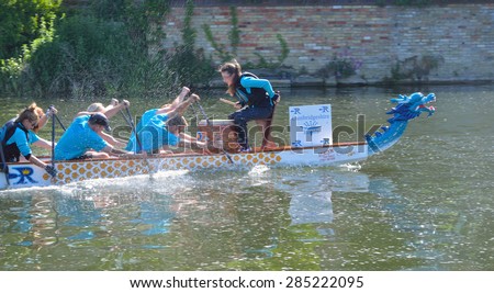 ST NEOTS, CAMBRIDGESHIRE, ENGLAND - JUNE 07, 2015: Dragon boat practice on the river Ouse St Neots Cambridgeshire.