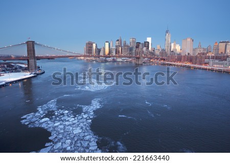 Winter in New York, Jan 24, 2014: Brooklyn Bridge and the Lower Manhattan at sunrise in New York City.