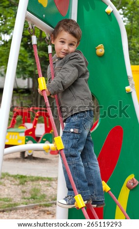 Little boy 3 years old playing at playground
